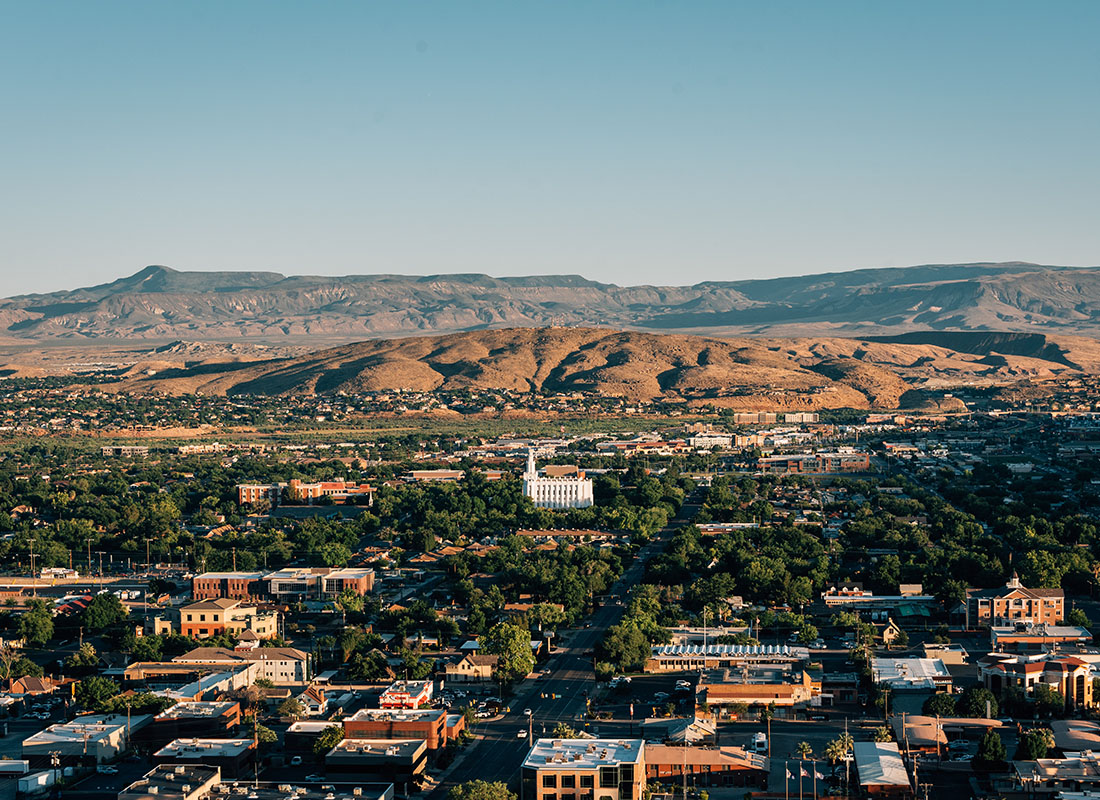 About Our Agency - Aerial View of Mountains Surrounding the City of St George Utah on a Sunny Day